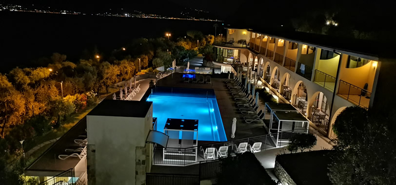 Swimming pool panoramic night view from above